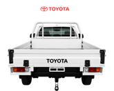 White Toyota truck bed on a white background with Toyota logo above.