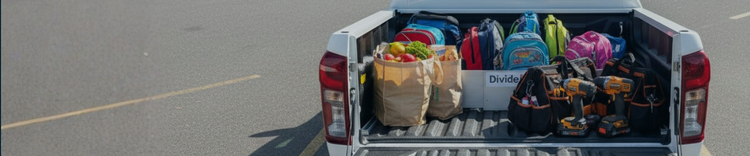 Trunk of a car filled with various items including bags, tools, and groceries.