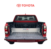 Red Toyota truck with an open bed and a TubDivider