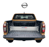 Back of a Nissan truck with an open cargo area and TubDivider separator.