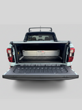Open truck bed with a tonneau cover and a TubDivider