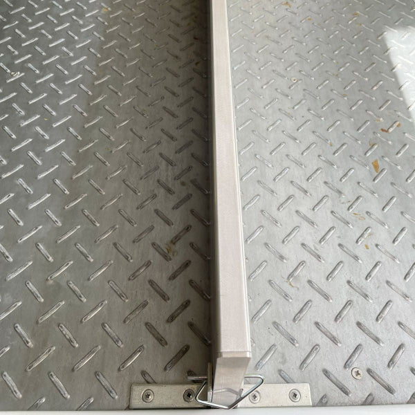 Close-up of a fixed divider panel seated
in its floor bracket